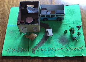 Modellbau einer Wohnung und eines Wohnwagens mit Garten